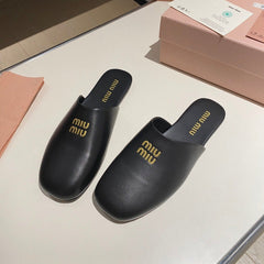 MULES SLIPPERS RETRO BLACK COWHIDE