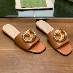 FLAT MULE IN BRONE BROWN CALFSKIN WITH GOLD HARDWARE