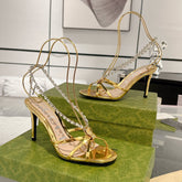 STRAPPY SANDAL WITH RHINESTONE CHAIN IN GOLD PATENT LEATHER