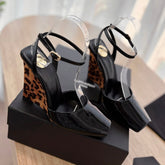 LA SCANDALE HIGH 10 CM WEDGE SANDALS IN BLACK PATENT LEATHER