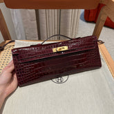 KELLY CUT 31 IN SANGRIA PURPLE ALLIGATOR LEATHER WITH GOLD HARDWARE