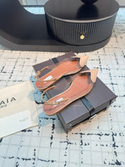 ALAIA FLAT SLINGBACK IN BEIGE BISQUE PATENT CALFSKIN AND FILM