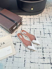 ALAIA FLAT SLINGBACK IN WHITE PATENT CALFSKIN AND FILM