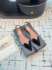 ALAIA FLAT SLINGBACK IN BLACK PATENT CALFSKIN AND FILM