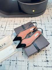 ALAIA FLAT SLINGBACK IN BLACK PATENT CALFSKIN AND FILM