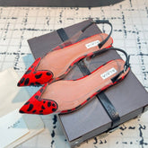 ALAIA FLAT SLINGBACK IN CHERRY RED PATENT CALFSKIN AND FILM