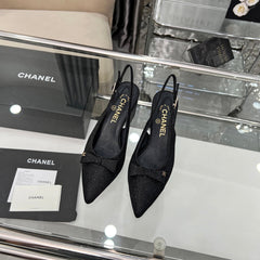 CHANEL 25S SANDALS WITH A BOW 60MM IN SPARKLING BLACK CANVAS
