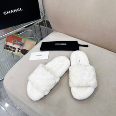 CHANEL 25S FUR SLIPPERS WITH EXPOSED-STITCH STRAPS IN WHITE