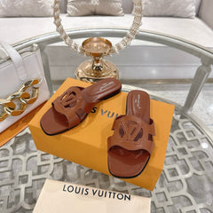 ISOLA FLAT SLIDE IN PENNY BROWN CALFSKIN