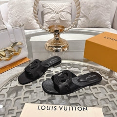 ISOLA FLAT SLIDE IN BLACK CALFSKIN