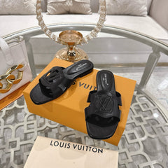 ISOLA FLAT SLIDE IN BLACK CALFSKIN