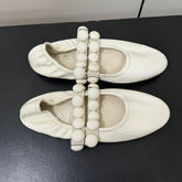 ALAIA SPHERE BALLET FLATS IN WHITE LAMBSKIN
