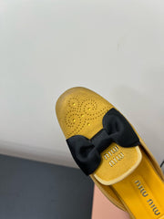 BOW MULES IN DUST YELLOW SUEDE
