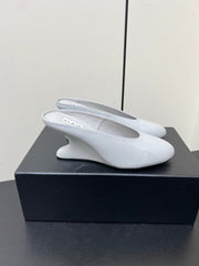 ALAIA WEDGE MULES 25S IN WHITE LAMBSKIN