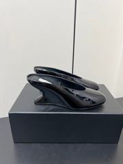 ALAIA WEDGE MULES 25S IN BLACK LAMBSKIN