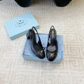 TRIANGLE LOGO SLINGBACK PUMPS WITH BOW IN BLACK CALFSKIN