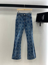 CHANEL FLARED JEANS WITH LOGO PRINT 263984