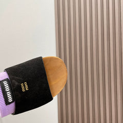 SLIPPERS IN BLACK SUEDE WITH PURPLE HALF-FOOT SOCKS