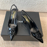 MID-HEEL SLINGBACKS IN BLACK PATENT CALFSKIN