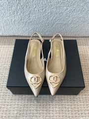 FLAT MULES IN BISQUE BEIGE PATENT CALFSKIN