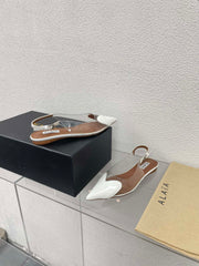 ALAIA LE COEUR FLAT SLINGBACKS IN WHITE PATENT LAMBSKIN