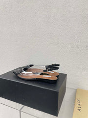 ALAIA LE COEUR FLAT SLINGBACKS IN BLACK PATENT LAMBSKIN