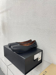 ALAIA BALLET FLATS IN BLACK CALFSKIN