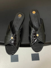 FLAT SLIPPERS IN BLACK CALFSKIN SNAKE EMBOSSING