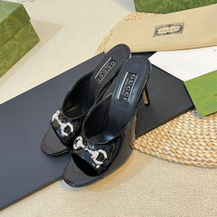 GG Women's Horsebit mid-heel slide sandal in glossy black leather