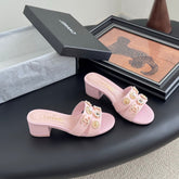 MULE SLIDE SANDALS IN PINK LAMBSKIN WITH LOGO STICKER DETAIL
