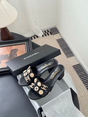 MULE SLIDE SANDALS IN BLACK LAMBSKIN WITH LOGO STICKER DETAIL