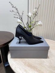 CURVED HEEL DEEP MOUTH PUMPS IN BLACK CALFSKIN