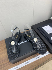 CC THONG SANDAL IN BLACK LAMBSKIN WITH PEARL FLOWER