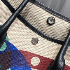 GARDEN PARTY 36 IN MULTICOLOR TOILE H CANVAS BLACK CALFSKIN OVERLAPPING POLKA RINGS PRINT