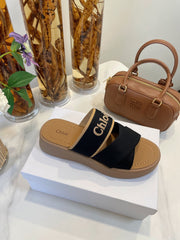 WOODY WEDGE SANDALS IN BLACK CANVAS WITH CIDER BROWN RUBBER SOLE