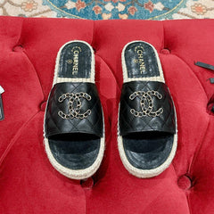 FLAT SLIPPERS IN BLACK LAMBSKIN AND WOVEN WITH LOGO
