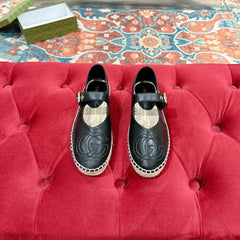 GG CROSS STRAP FLAT SHOES IN BLACK CALFSKIN WITH STRAW SOLE