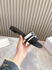 DIOR FLAT SLIDES 25S IN BLACK CALFSKIN AND FABRIC BRAND NAME EMBROIDERY