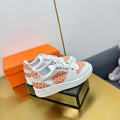 FREE SNEAKER IN WHITE CALFSKIN AND "H EN BIAIS" ORANGE CANVAS
