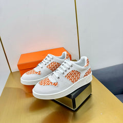 FREE SNEAKER IN WHITE CALFSKIN AND "H EN BIAIS" ORANGE CANVAS
