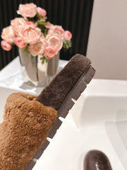 PRADA 25S FLAT MULES IN DARK BROWN RABBIT FUR