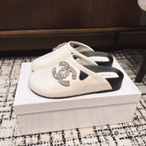 FLAT MULES IN WHITE CALFSKIN
