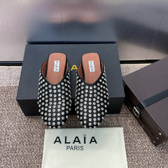ALAIA FLAT MULES 25S IN BLACK LAMBSKIN EMBELLISHED WITH CRYSTALS