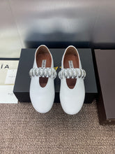 ALAIA MARY JANE FLATS 25S IN WHITE CALFSKIN WITH SILVER HARDWARE