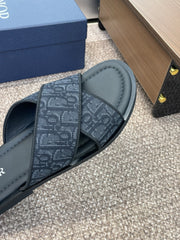 DIOR 25S ALIAS CROSS-STRAP SLIDES IN BLACK CALFSKIN WITH CD OBLIQUE DARK BLUE LOGO