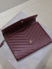 CASSANDRE CLUTCH 21 IN BORDEAUX RED LAMBSKIN GOLD HARDWARE