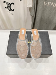 ALAIA FLAT MULES IN SILVER MESH FISHNET
