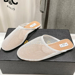 ALAIA FLAT MULES IN WHITE MESH FISHNET