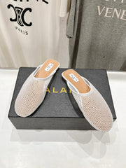 ALAIA FLAT MULES IN WHITE MESH FISHNET