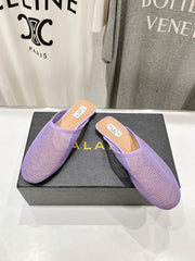 ALAIA FLAT MULES IN LIGHT PURPLE MESH FISHNET